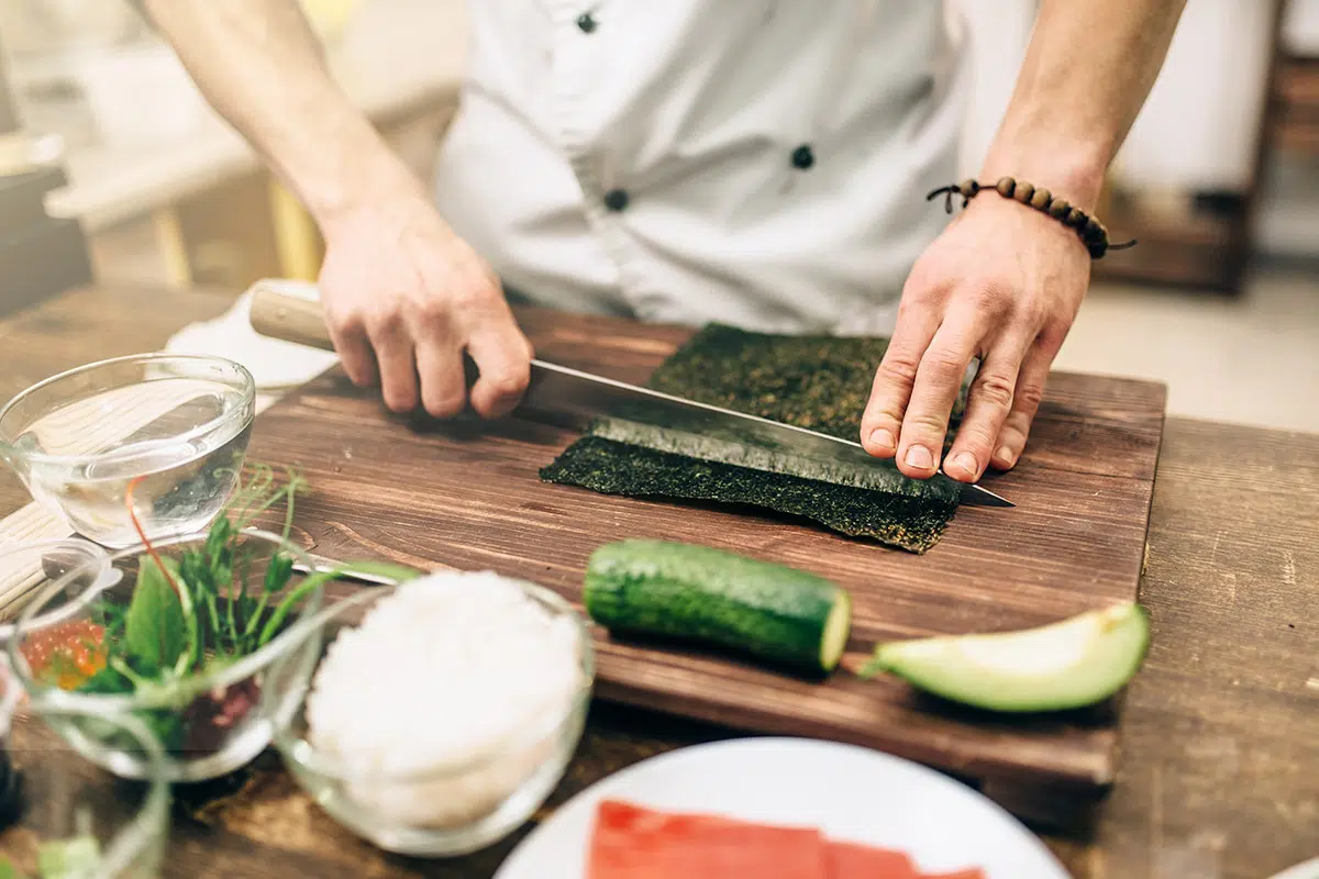 Food Preparation Worker Cutting Up Meat