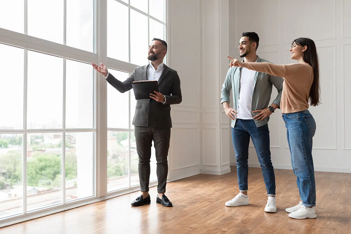 Property Manager Showing A Property To A Young Couple